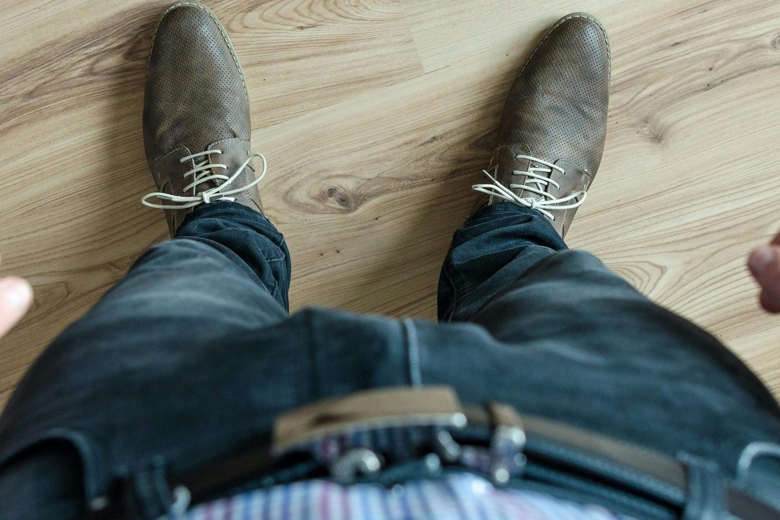 pexels-photo-928183-928183 A top-down view of a man's outfit, showcasing a casual business look with shoes and checkered shirt.